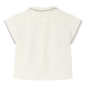 Back view of Bonpoint's Baby Boys' and Boys' Lennard Shirt, an off-white, short-sleeve organic cotton shirt featuring dark stitched details on the collar and sleeve edges.