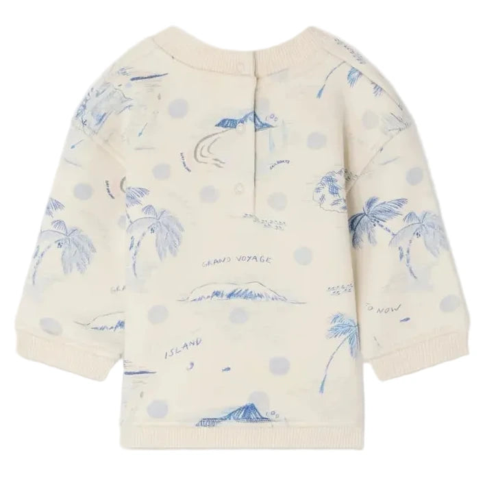 The Bonpoint Baby Boys' and Boys' Dady Sweatshirt features a blue island print with palm trees and ocean illustrations, light blue polka dots, and a back button closure. Made from soft organic cotton fleece for ultimate comfort.