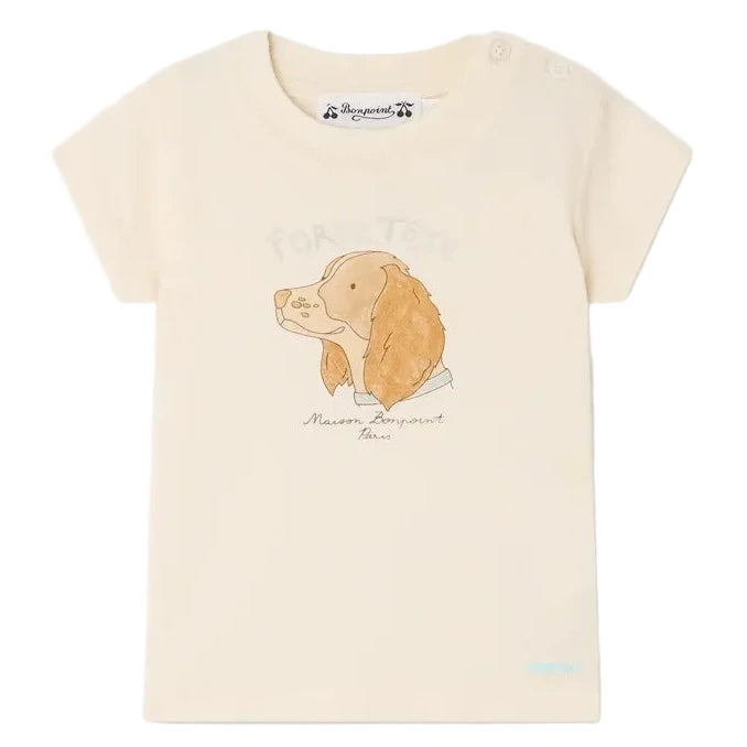 The Bonpoint Baby Boys' Tom T-Shirt is a cream-colored cotton jersey tee featuring a cute dog print with text above and below the illustration.