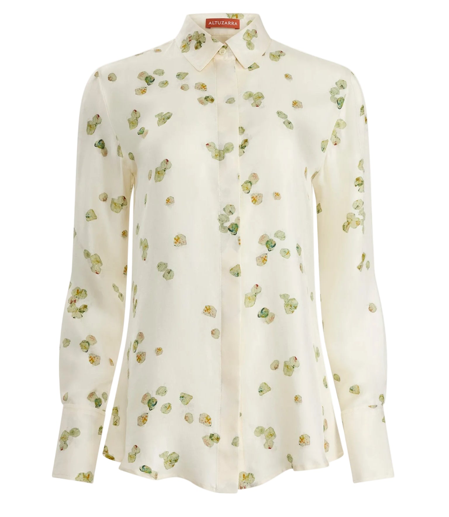 The Chika Top by Altuzarra is a cream silk, long-sleeve button-down with green and yellow floral print, pointed collar, and cuffed sleeves for a relaxed look.