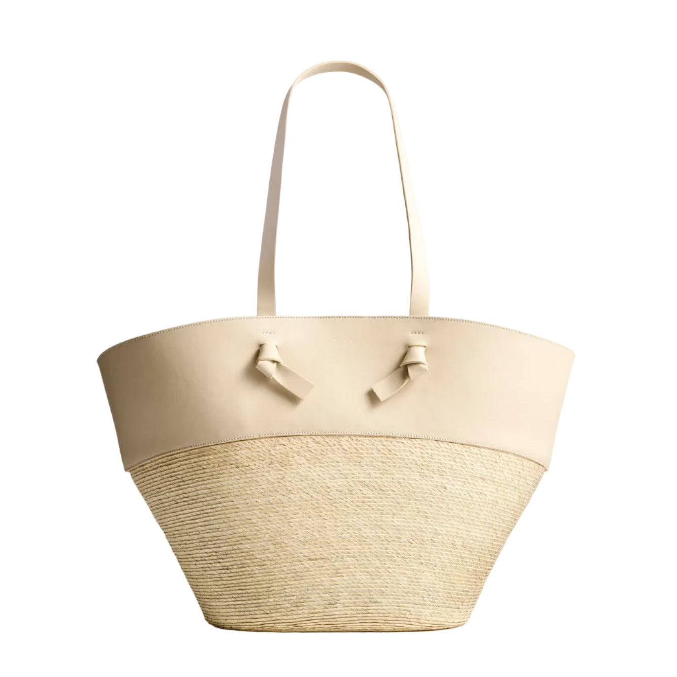 The Altuzarra Knot Basket Large is a beige bag with leather handles, a leather top panel, and a woven raffia bottom, shown against a white background.
