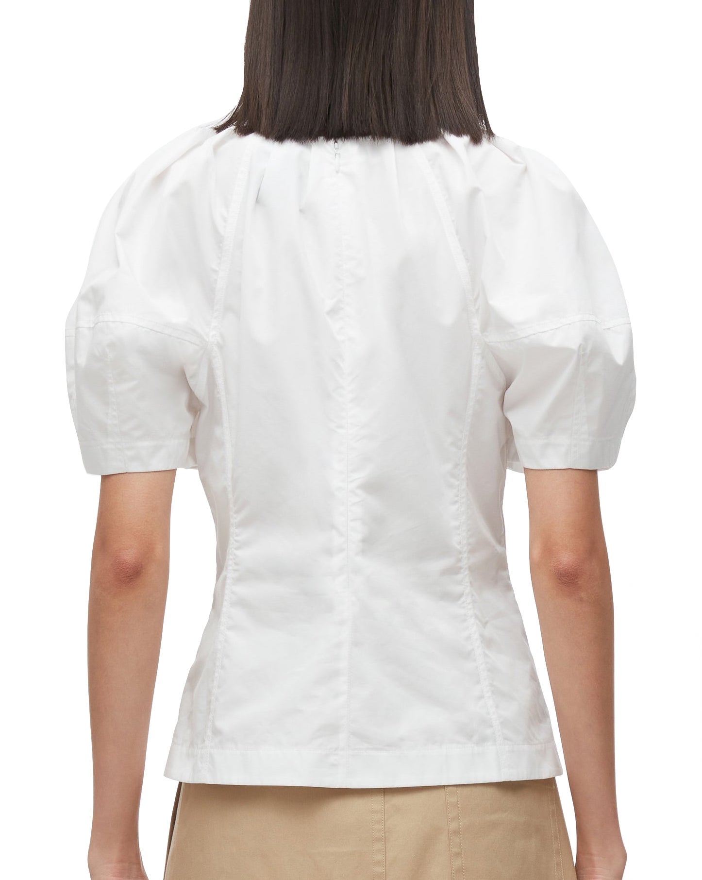 Rear view of a person wearing a 3.1 Phillip Lim Bloom Sleeve Scoop Neck Top with gathered details on the back.