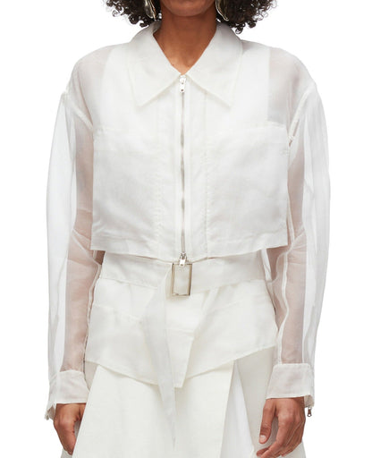 Person wearing a 3.1 Phillip Lim Organza Belted Flounce Jacket by 3.1 Phillip Lim. The smart casual jacket is paired with a white skirt.