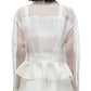 Person wearing a sheer white blouse with long sleeves and a ruffled hem, paired with the 3.1 Phillip Lim Organza Belted Flounce Jacket by 3.1 Phillip Lim, seen from the back.