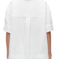 Rear view of a person wearing a 3.1 Phillip Lim Oversized Camp Shirt in plain white, with a center back pleat detail.