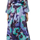 The Solana Dress by Figue is a long, floral-patterned masterpiece in Silk Chiffon with blue, green, and purple hues. Its chic removable self-belt adds versatility, making it perfect for spring events.