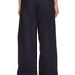 A person is shown from the back wearing 3.1 Phillip Lim Structured Cotton Pull-On Straight Leg Pants, featuring a loose fit and an elastic waistband in dark navy.
