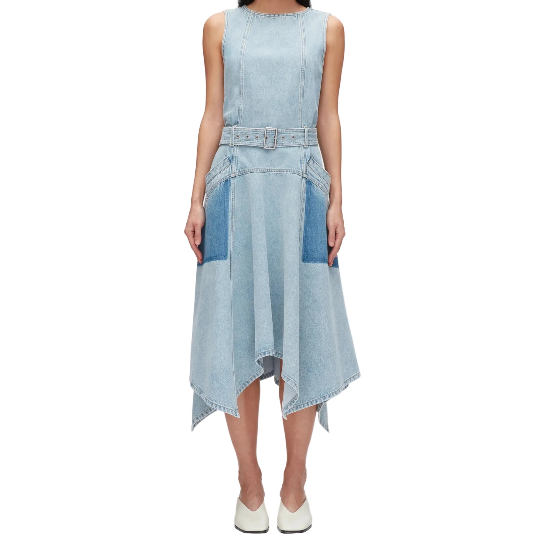 A person wearing the 3.1 Phillip Lim Ghost Patch Midi Denim Dress, featuring a matching adjustable belt, two front pockets, and a handkerchief hem, paired with white shoes.