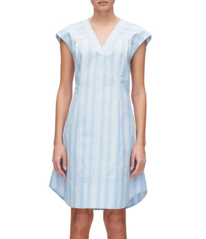 A person models the 3.1 Phillip Lim Striped Cap Sleeve Knee-Length Dress, featuring light blue and white vertical stripes and a V-neckline—ideal for spring and summer—against a white background.
