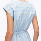 A person is seen from the back wearing the 3.1 Phillip Lim Striped Cap Sleeve Knee-Length Dress with a thin waist belt—an ideal spring and summer look.