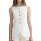 A woman wears the POSSE Emma Vest, a sleeveless white tailored vest with brown buttons, front pockets, and an adjustable back buckle, paired with white shorts. Her face is partially out of frame.