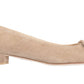 The Ann Mashburn Suede Buckle Shoe is a beige calf suede flat featuring a demi heel with front bow detail.