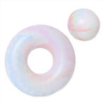 The Sunnylife Tube Pool Ring and Ball Set in tie dye hues sits on a white background, embodying the spirit of summer enjoyment.