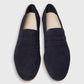 The Ann Mashburn Mia Suede Loafer: navy blue Italian suede loafers with tan insoles and light brown soles—an elevated staple for any menswear collection, shown from above on a plain background.