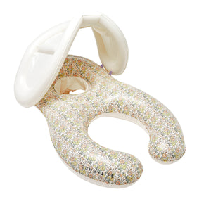 The Sunnylife Garden Ditsy Floral Float Together Baby Seat features a charming floral pattern, built-in shade canopy, and a circular seat opening, thoughtfully designed for young children.