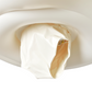 A deflated and crumpled Garden Ditsy Floral Float Together Baby Seat by Sunnylife, its white surface reminiscent of a discarded pool float, is stuck in the opening of a white light fixture and photographed from below.