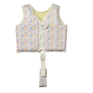 Sunnylife Kids' Swim Vest in a children’s floral pattern, featuring a front zipper, buckle closure, and an adjustable anti-rise safety strap between the legs for enhanced security. Crafted with a soft neoprene comfort guard, this life vest is displayed against a white background.