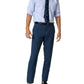 A person in Sid Mashburn Sport Trousers, a light blue striped dress shirt with rolled sleeves, dark blue tie, black belt, and black loafers.