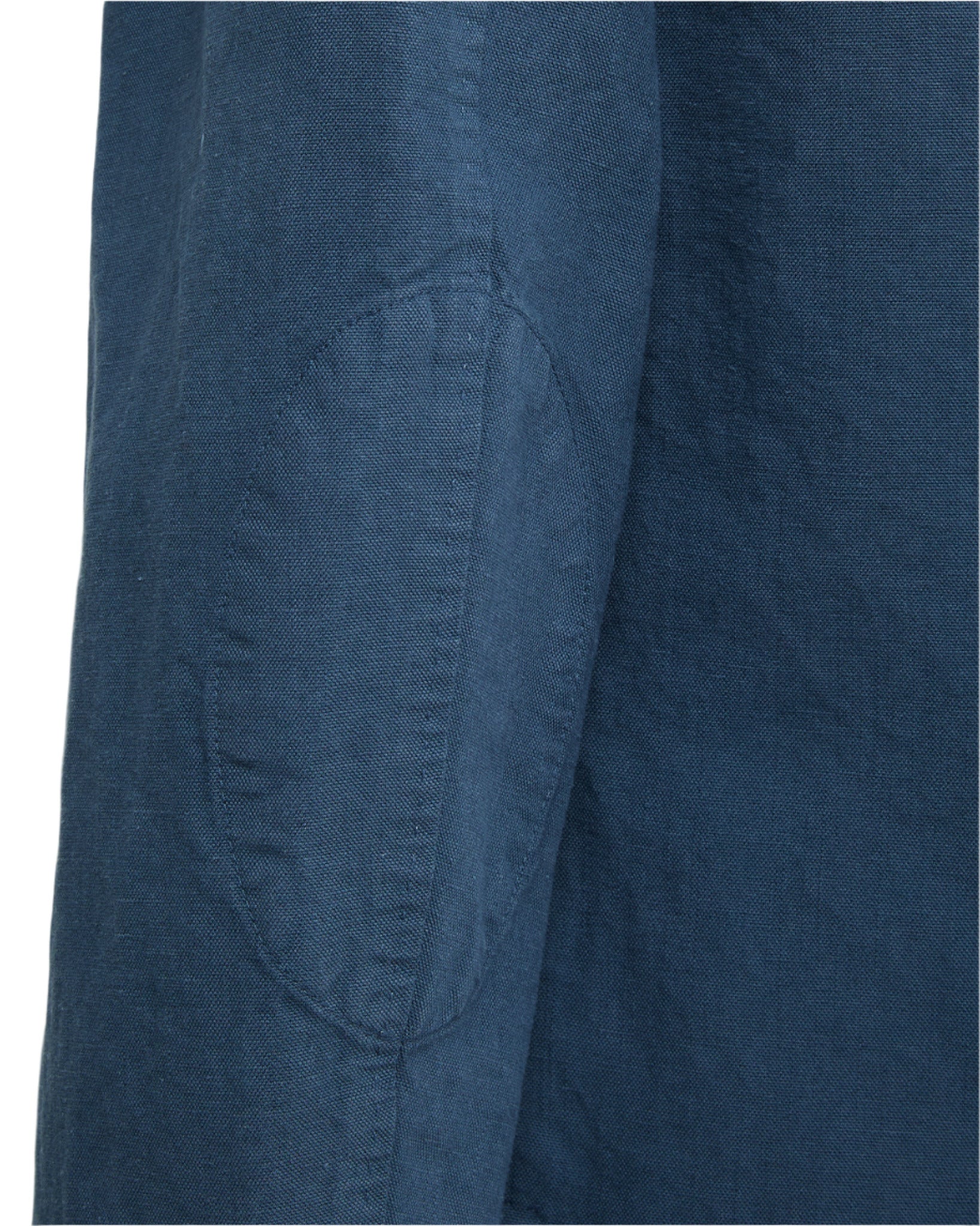 Close-up of a blue Portuguese chambray sleeve on the Sid Mashburn Butcher Jacket, featuring an oval reinforced elbow patch.