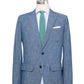 The Sid Mashburn Butcher Jacket, a blue Portuguese chambray blazer with notch lapels, spalla camicia construction, two buttons, patch pockets, and a breast pocket, is shown on a mannequin with a white shirt and green textured tie.
