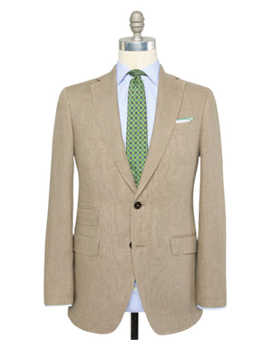 The Sid Mashburn Kincaid No.2 Jacket in beige Italian hopsack is shown on a mannequin with a light blue dress shirt and a green patterned tie.