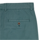Close-up of Sid Mashburn's Garment-Dyed Field Pant in teal cotton twill, featuring a back pocket with button closure, belt loops at the waistband, and crafted from durable four-season fabric.