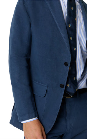 Model wearing the Sid Mashburn Butcher Jacket, styled with a striped shirt and patterned tie, featuring spalla camicia construction; shown from shoulders to upper thigh.