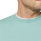 A close-up of a man's lower face and neck shows him wearing the Sid Mashburn Fine-Gauge Crewneck Sweater in light green over a white shirt, set against a white background.