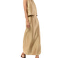 A person in the Ann Mashburn Gia Silk Shantung Top and matching ankle-length skirt with brown heeled sandals stands against a white background.