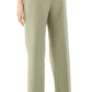 A person wearing the Ann Mashburn Hutton Stretch Canvas Pant in light green, brown heeled sandals, and a long-sleeve striped shirt is photographed from the back.