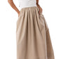 A person wearing the Cosette Cotton Silk Dress by Ann Mashburn with brown heeled sandals.