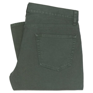 The Sid Mashburn Clift Jean is a pair of green five-pocket jeans in garment-dyed proprietary denim, neatly folded to display the back pocket and waistband with belt loops.