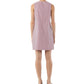 A person stands facing away, wearing the Ann Mashburn Susy Shift Dress—a sleeveless, knee-length, red and white vertically striped 1960s A-line dress in Japanese compact cotton—with black sandals.