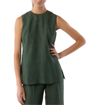 A woman wears the Ann Mashburn Jo Tunic, a sleeveless dark green top with princess seams, along with matching pants, standing with one hand on her hip against a plain white background.