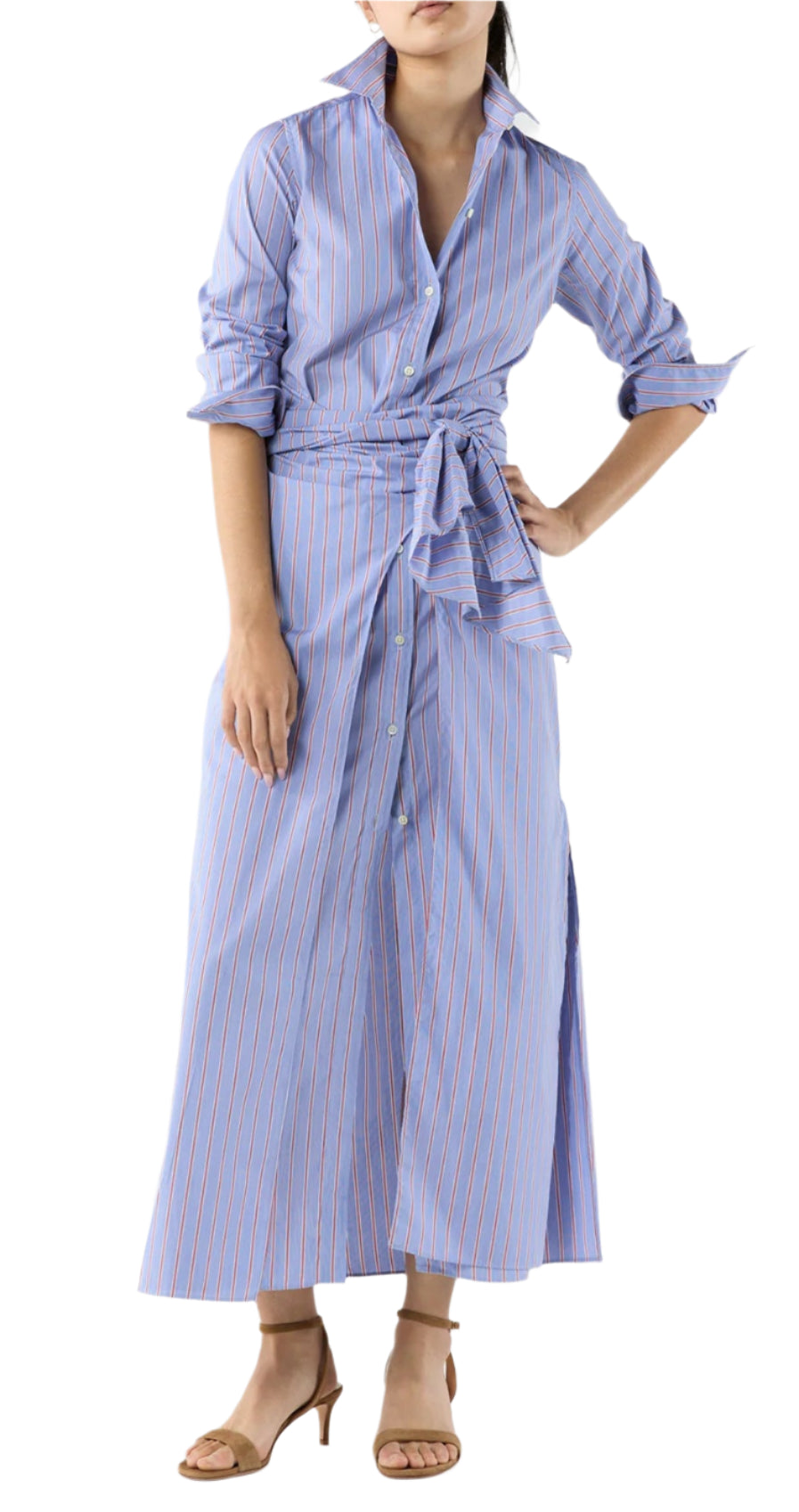 A woman wears the Ann Mashburn Maxi Tie-Waist Shirtdress in blue and white stripes with rolled sleeves and beige heeled sandals.