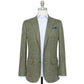The Sid Mashburn Ghost Blazer in light gray Italian hopsack, shown over a light blue shirt with a blue pocket square, is the perfect lightweight year-round jacket for refined texture and effortless style.