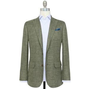 The Sid Mashburn Ghost Blazer in light gray Italian hopsack, shown over a light blue shirt with a blue pocket square, is the perfect lightweight year-round jacket for refined texture and effortless style.