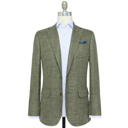 The Sid Mashburn Ghost Blazer in light gray Italian hopsack, shown over a light blue shirt with a blue pocket square, is the perfect lightweight year-round jacket for refined texture and effortless style.