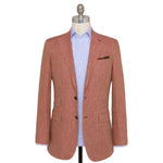 The Sid Mashburn Kincaid No. 3 Jacket in salmon, featuring full canvas construction, is styled over a light blue dress shirt and displayed on a mannequin against a white background.