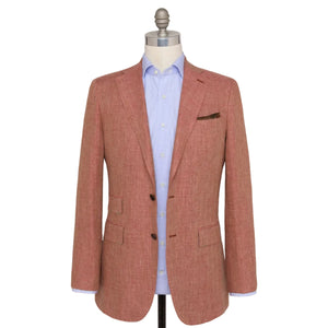 The Sid Mashburn Kincaid No. 3 Jacket in salmon, featuring full canvas construction, is styled over a light blue dress shirt and displayed on a mannequin against a white background.