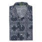 Sid Mashburn Ripley Shirt—an updated nod to the classic 1950s vacation shirt, this long-sleeve, patchworked paisley shirt features a blue and white bandana print, button front, and visible green tag inside the collar.