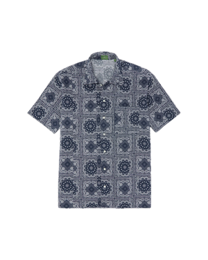 The Sid Mashburn Ripley Shirt, a short-sleeve button-up featuring a navy and white geometric pattern inspired by 1950s vacation styles, is laid flat on a white background.