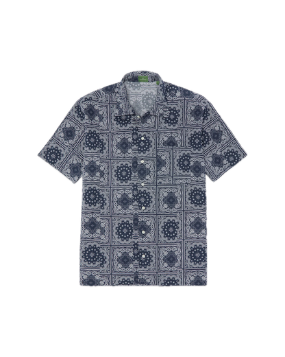 The Sid Mashburn Ripley Shirt, a short-sleeve button-up featuring a navy and white geometric pattern inspired by 1950s vacation styles, is laid flat on a white background.