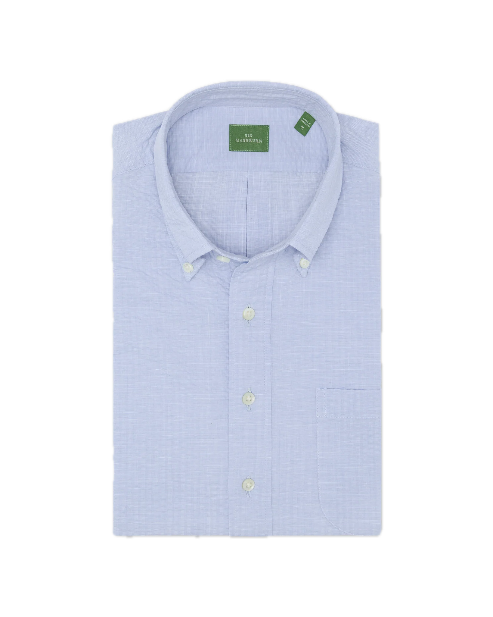 Short-sleeved button-down popover sport shirt by Sid Mashburn in textured blue, featuring a front pocket and a green label, displayed on a white background.