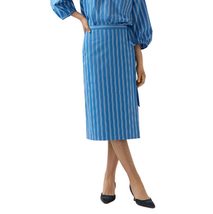 A person wears the Ann Mashburn Morgan Variegated Stripe Skirt with a matching blouse and black pointed-toe shoes, standing against a white background.