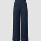 The Sailor Pant by Callas Milano is a navy blue cotton twill wide-leg style featuring front patch pockets, belt loops, and a button closure, shown against a plain light gray background.