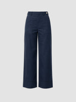 The Sailor Pant by Callas Milano is a navy blue cotton twill wide-leg style featuring front patch pockets, belt loops, and a button closure, shown against a plain light gray background.
