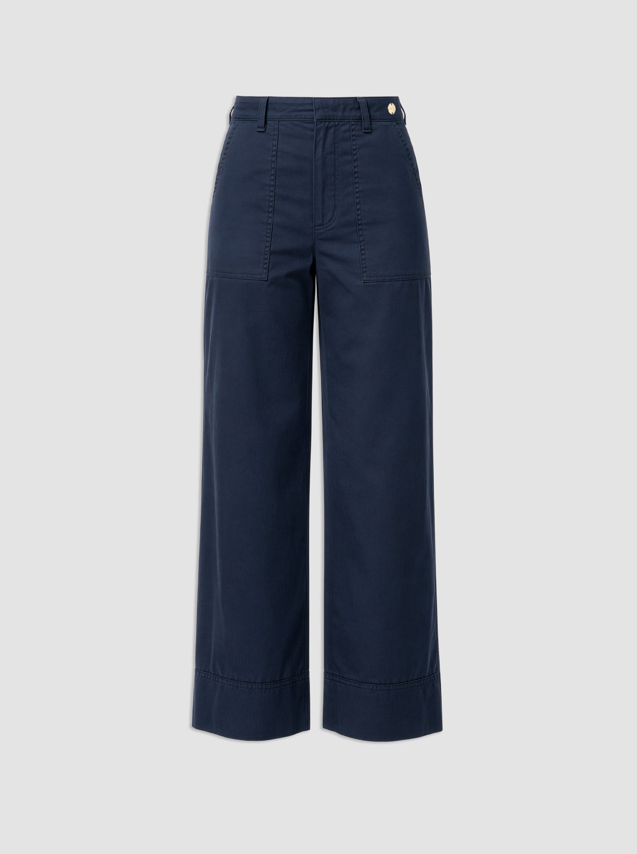 The Sailor Pant by Callas Milano is a navy blue cotton twill wide-leg style featuring front patch pockets, belt loops, and a button closure, shown against a plain light gray background.