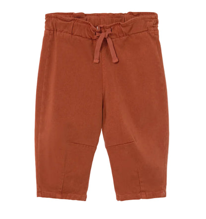 A pair of Cozmo Baby Saul Twill Pants in a rust color, featuring an elastic waistband and drawstring, displayed flat on a white background.