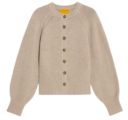 The Sculpted Cardigan by Guest in Residence is a beige cashmere sweater with long puffed sleeves, ribbed cuffs and hem, and a front button closure.